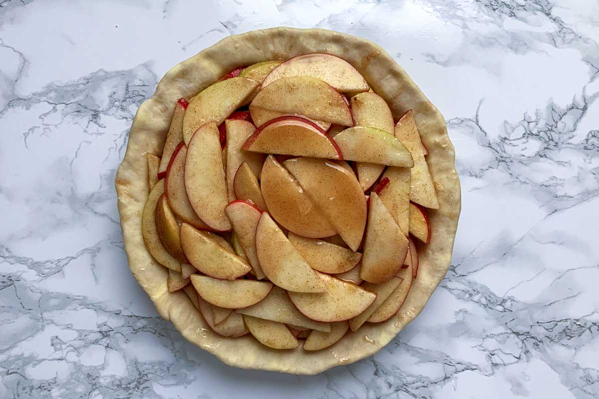 Crust filled with apple pie filling